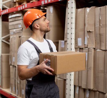 A logistics professional reviewing documents on a tablet